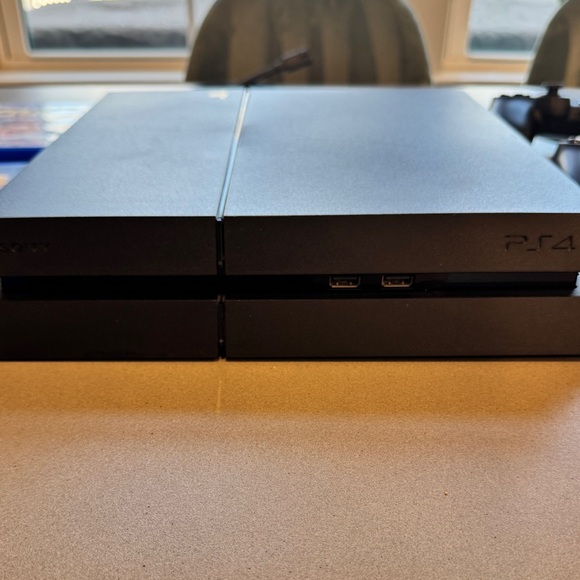 Sony PlayStation 4 Console with Controllers and Games - Black